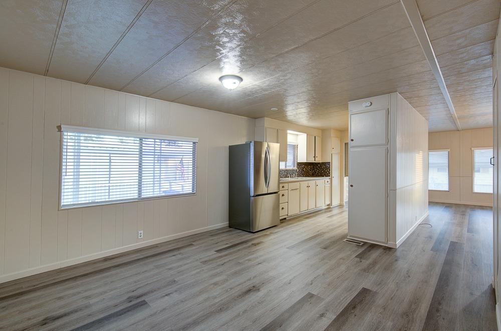 1500 Villa Avenue, Unit 27 Clovis, CA 93612 - Photo 20 of 29 a view of a kitchen with a refrigerator wooden floor and a kitchen