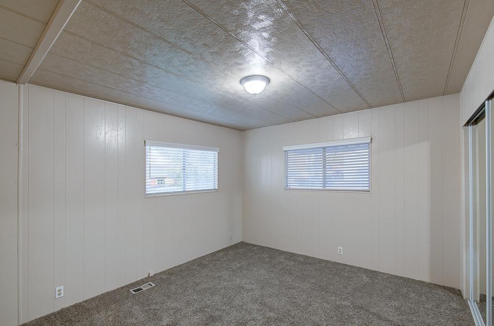 1500 Villa Avenue, Unit 27 Clovis, CA 93612 - Photo 23 of 29 an empty room with a empty space and windows