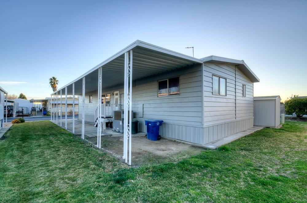 1500 Villa Avenue, Unit 27 Clovis, CA 93612 - Photo 7 of 29 a front view of a house with a yard