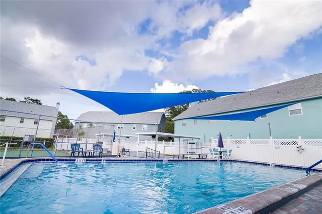 a kitchen with stainless steel appliances kitchen island granite countertop a sink and cabinets