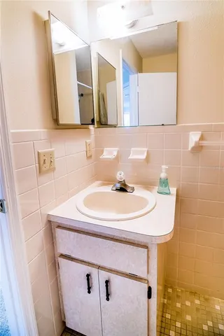 a bathroom with a sink and a mirror