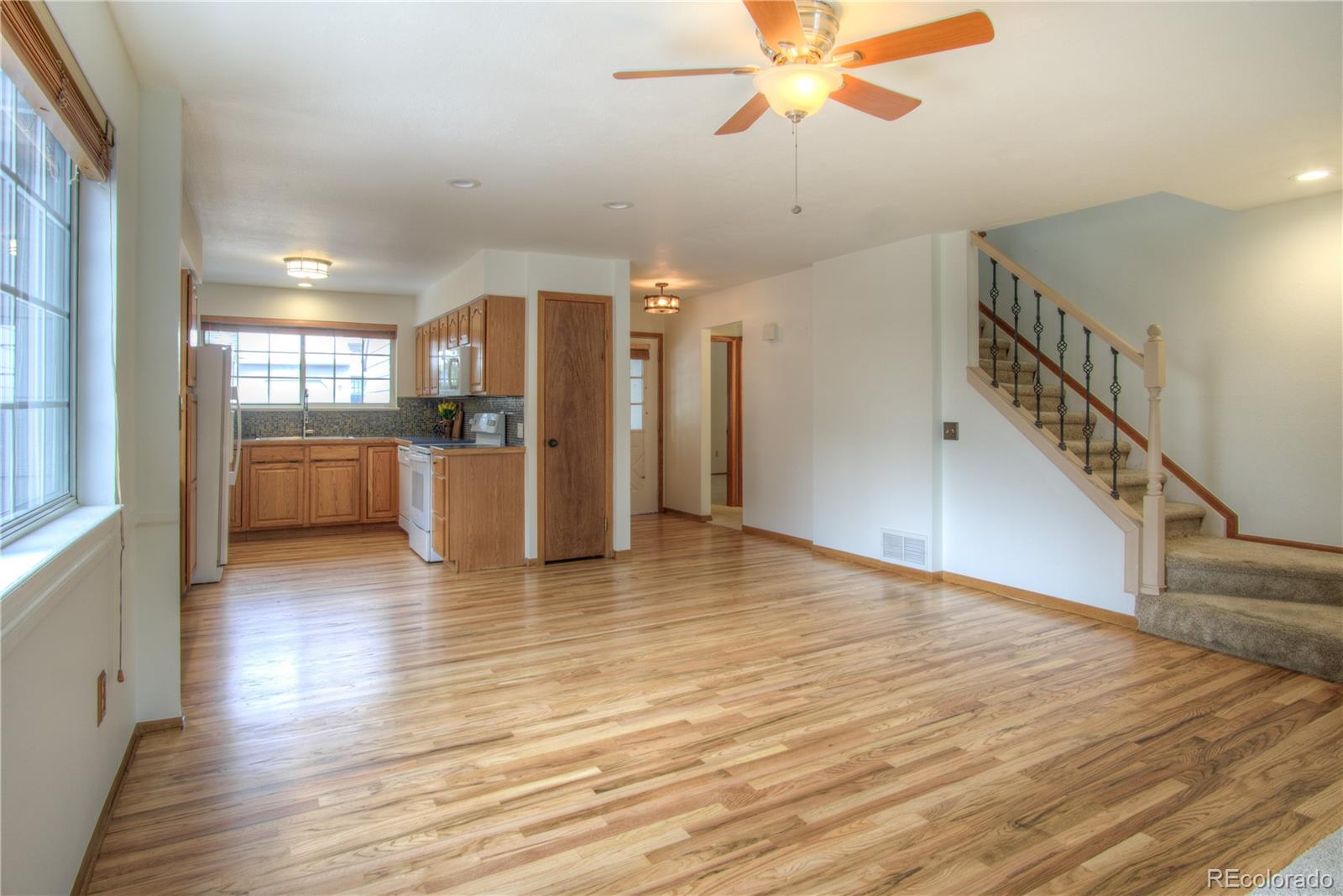 10385 East Red Mountain Road Littleton, CO 80127 - Photo 13 of 47 a view of a kitchen with a sink and a window