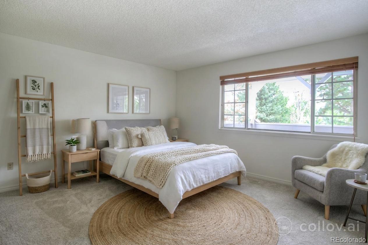 10385 East Red Mountain Road Littleton, CO 80127 - Photo 15 of 47 a bedroom with a bed and a couch