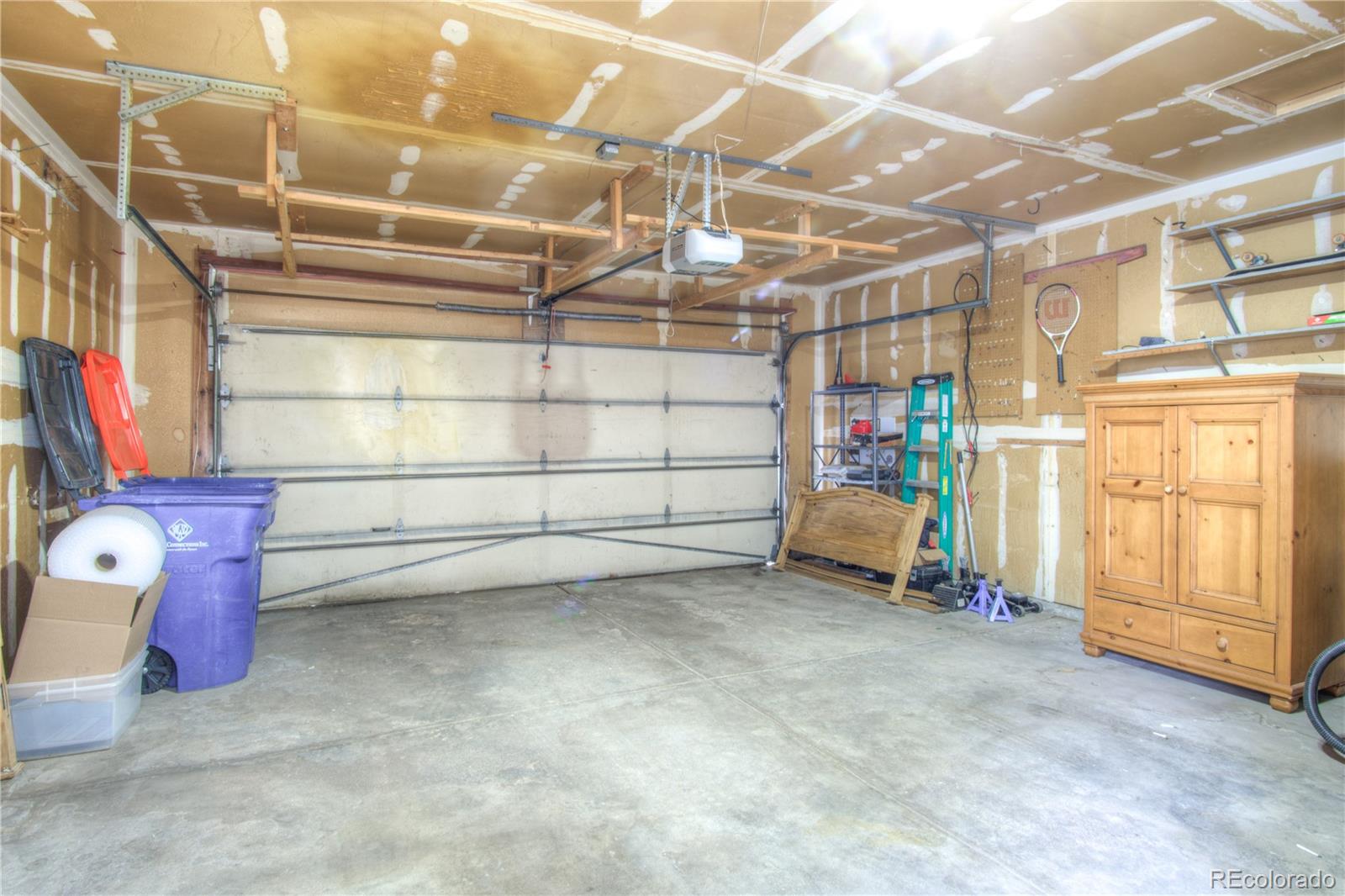 10385 East Red Mountain Road Littleton, CO 80127 - Photo 38 of 47 a view of a room with racks on the wall