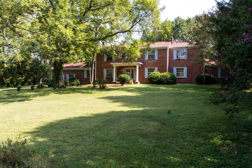 1109 Neelys Bend Road Madison, TN 37115 - Photo 1 of 30 a front view of a house with a yard