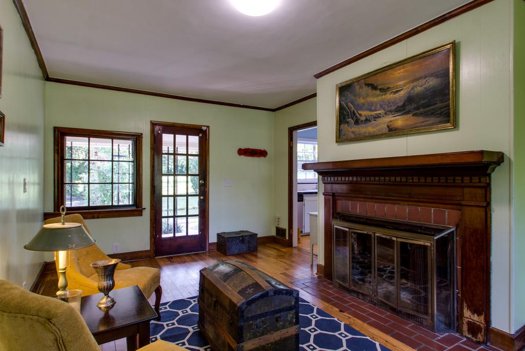 1109 Neelys Bend Road Madison, TN 37115 - Photo 11 of 30 a living room with furniture a window and a fireplace