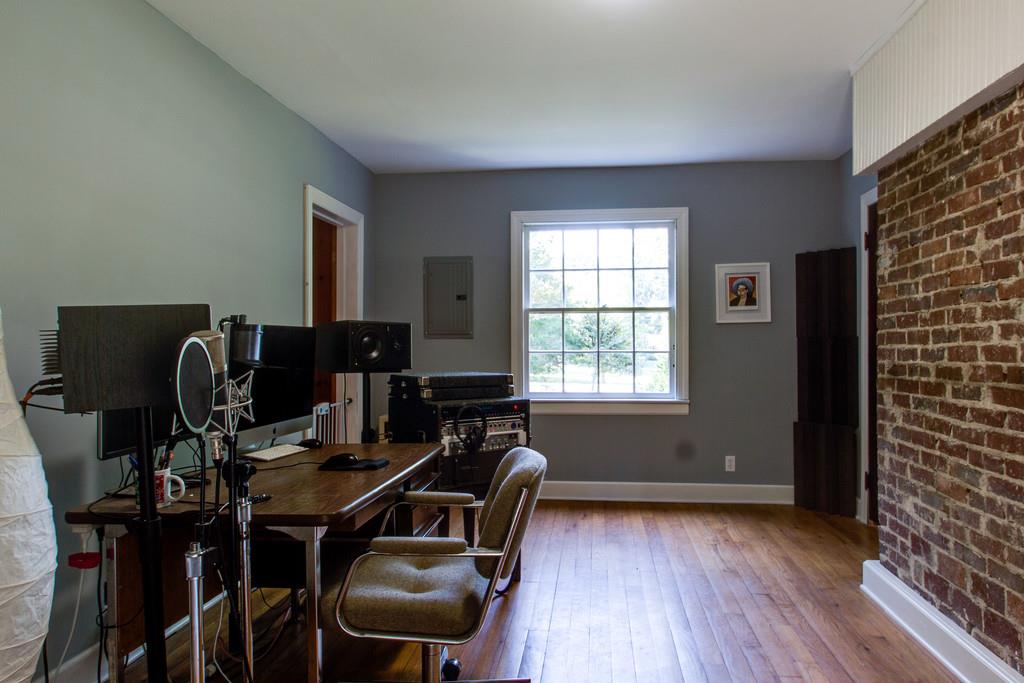 1109 Neelys Bend Road Madison, TN 37115 - Photo 15 of 30 a view of a workspace with furniture and a window