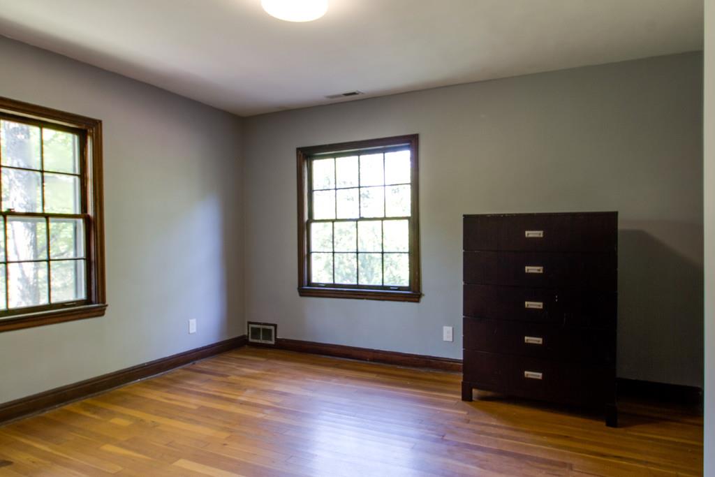 1109 Neelys Bend Road Madison, TN 37115 - Photo 20 of 30 an empty room with wooden floor and windows