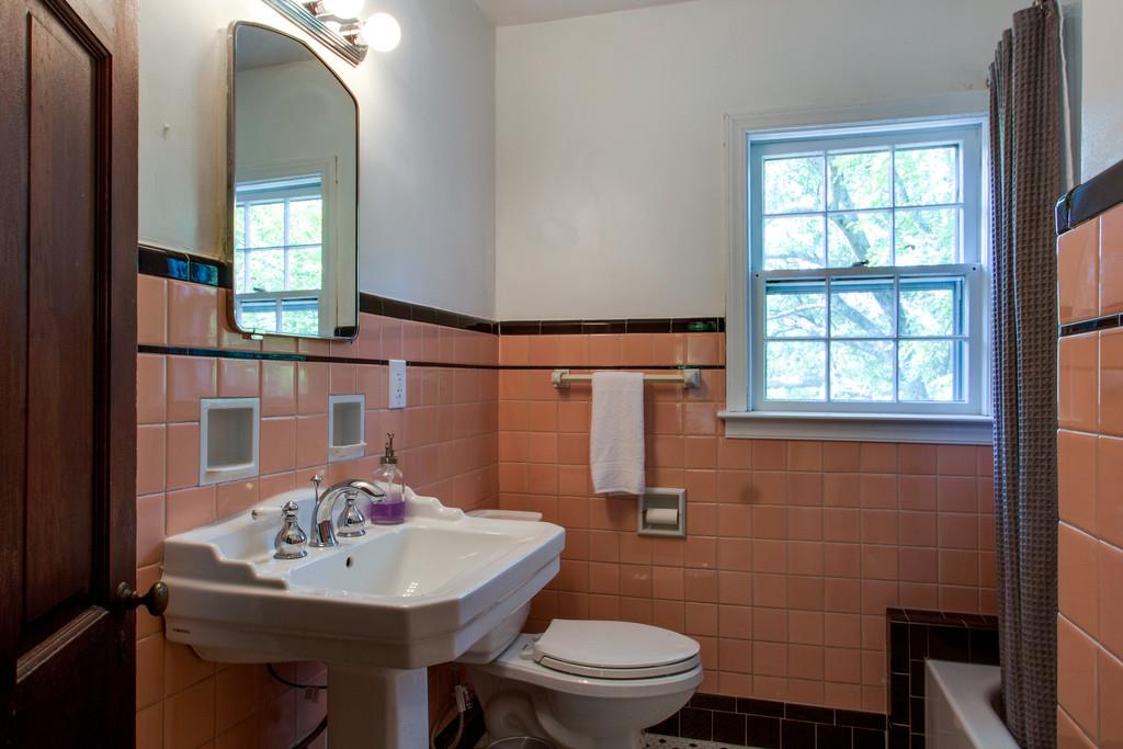 1109 Neelys Bend Road Madison, TN 37115 - Photo 22 of 30 a bathroom with a toilet sink and mirror