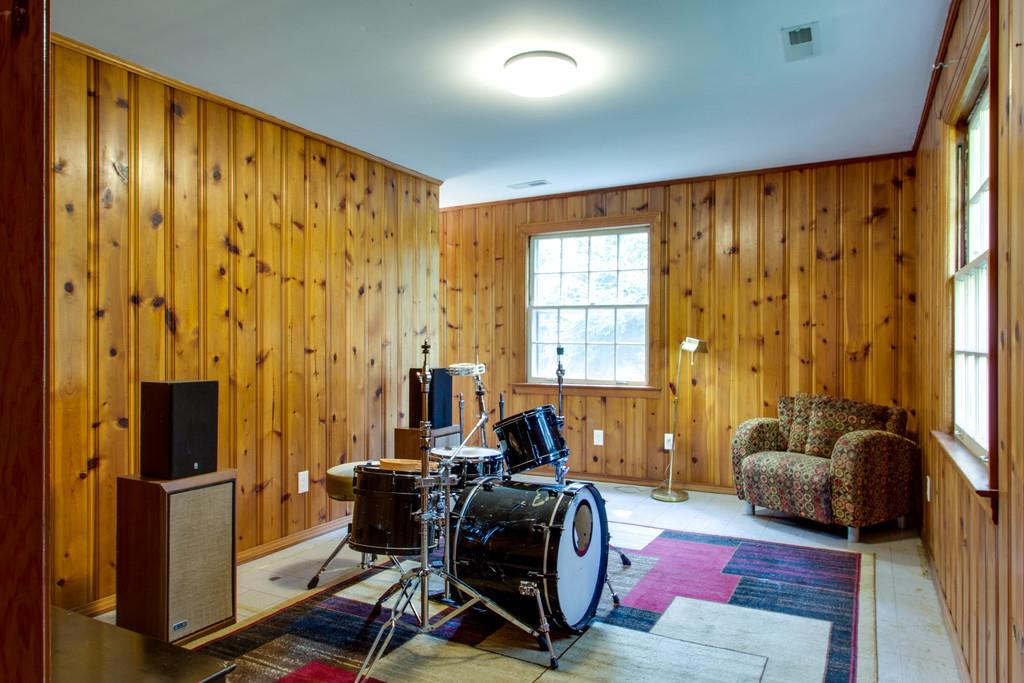 1109 Neelys Bend Road Madison, TN 37115 - Photo 23 of 30 a living room with furniture and a flat screen tv
