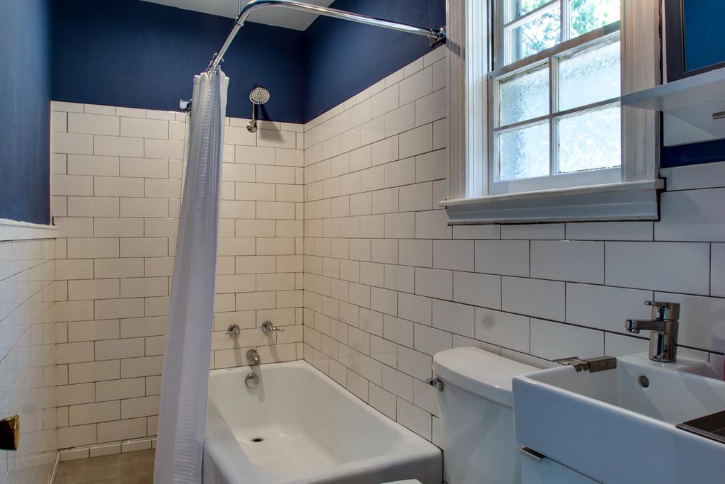1109 Neelys Bend Road Madison, TN 37115 - Photo 24 of 30 a bathroom with a bathtub and sink