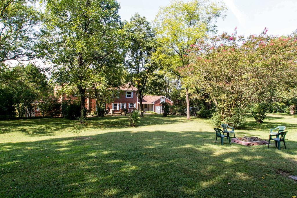 1109 Neelys Bend Road Madison, TN 37115 - Photo 30 of 30 a backyard of a house with a yard and outdoor seating