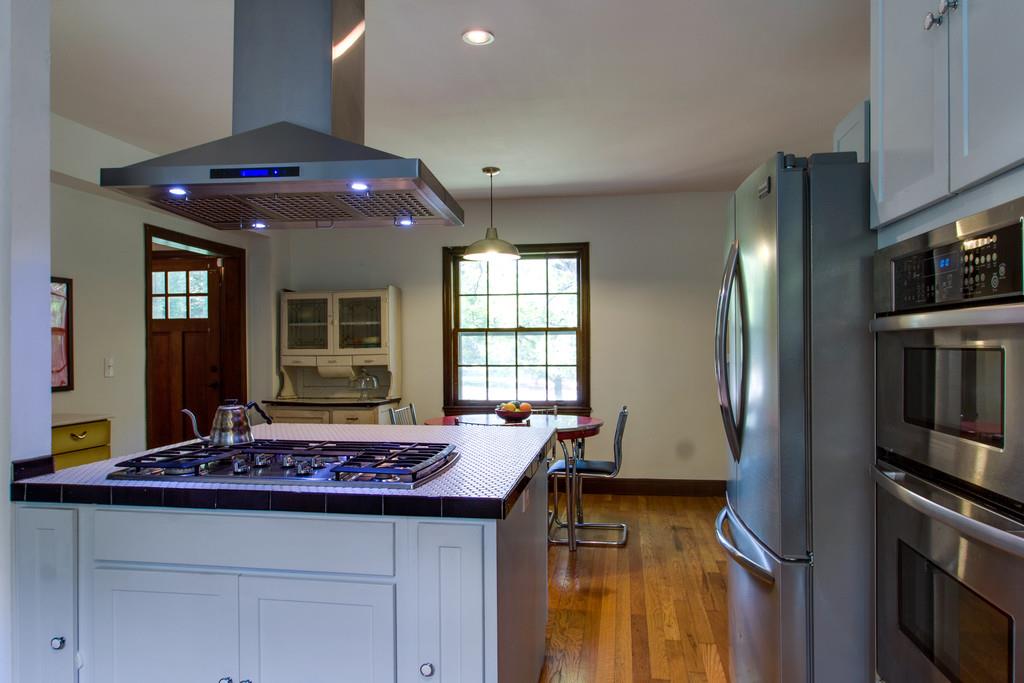 1109 Neelys Bend Road Madison, TN 37115 - Photo 6 of 30 a kitchen with stove and refrigerator