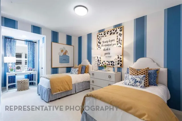 a bedroom with two beds and a large mirror