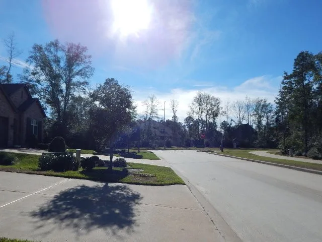 a view of a street with a building in the background