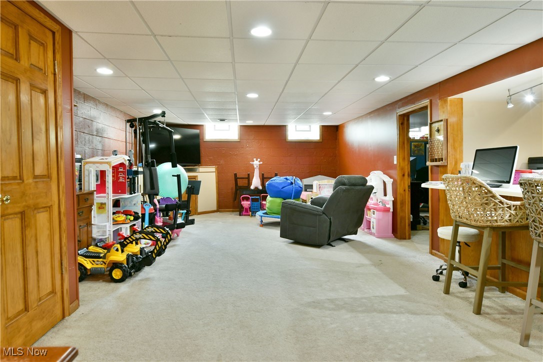 2847 Selkirk Bush Road Warren, OH 44481 - Photo 28 of 47 Recreation room featuring carpet floors, recessed lighting, and a drop ceiling