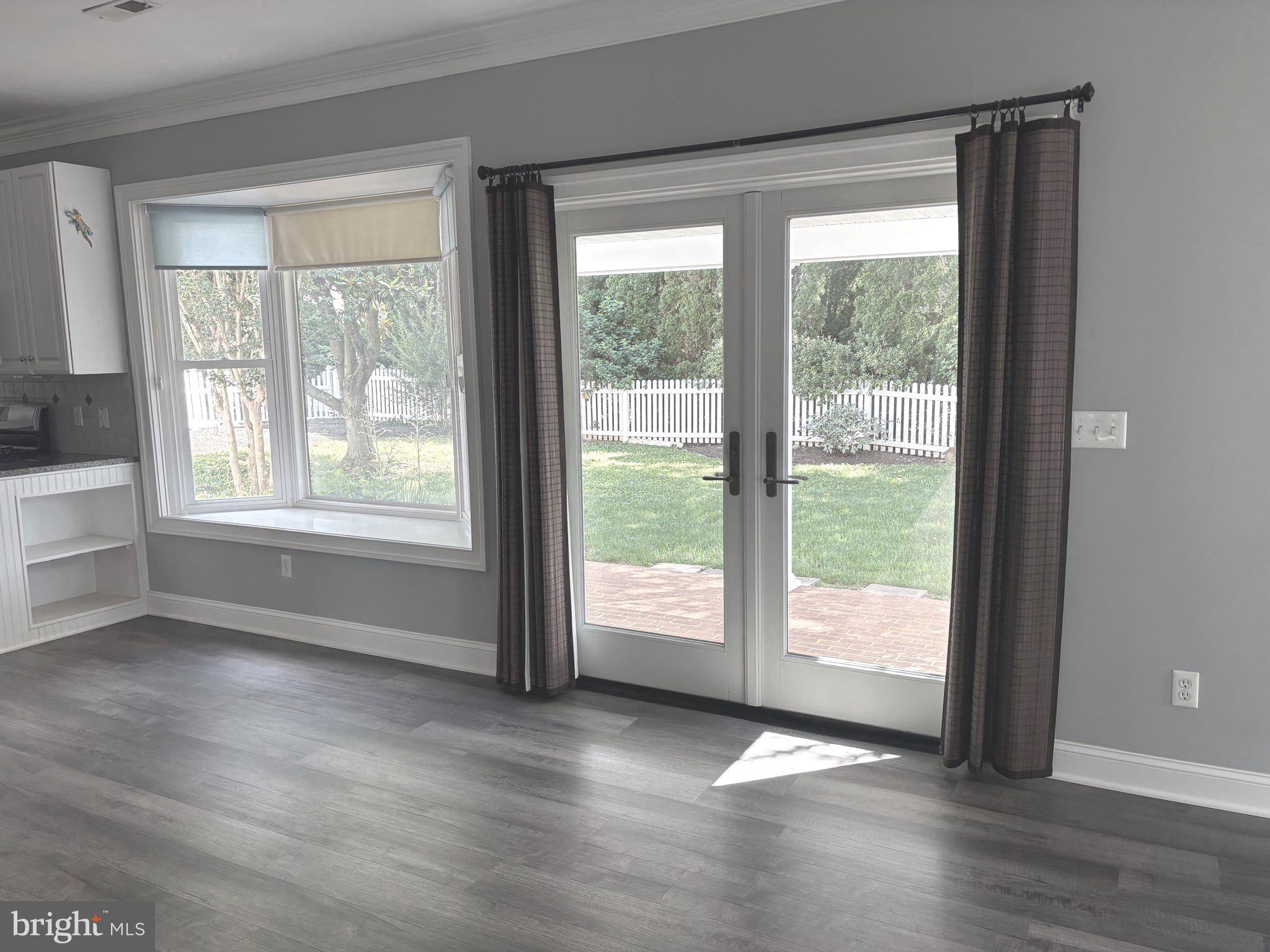 629 Country Club Road Culpeper, VA 22701 - Photo 9 of 27 a view of an empty room with wooden floor and a window