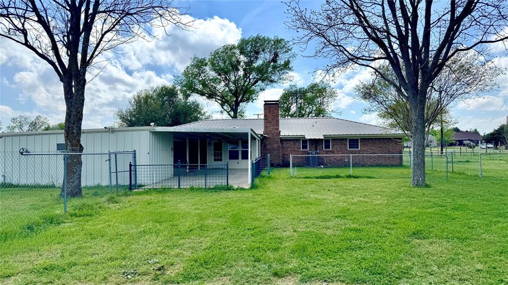 2050 Griffith Avenue Terrell, TX 75160 - Photo 25 of 27 a view of a house with a yard