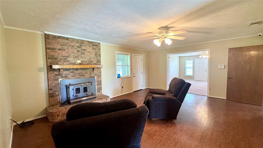 2050 Griffith Avenue Terrell, TX 75160 - Photo 3 of 27 a living room with furniture and a fireplace