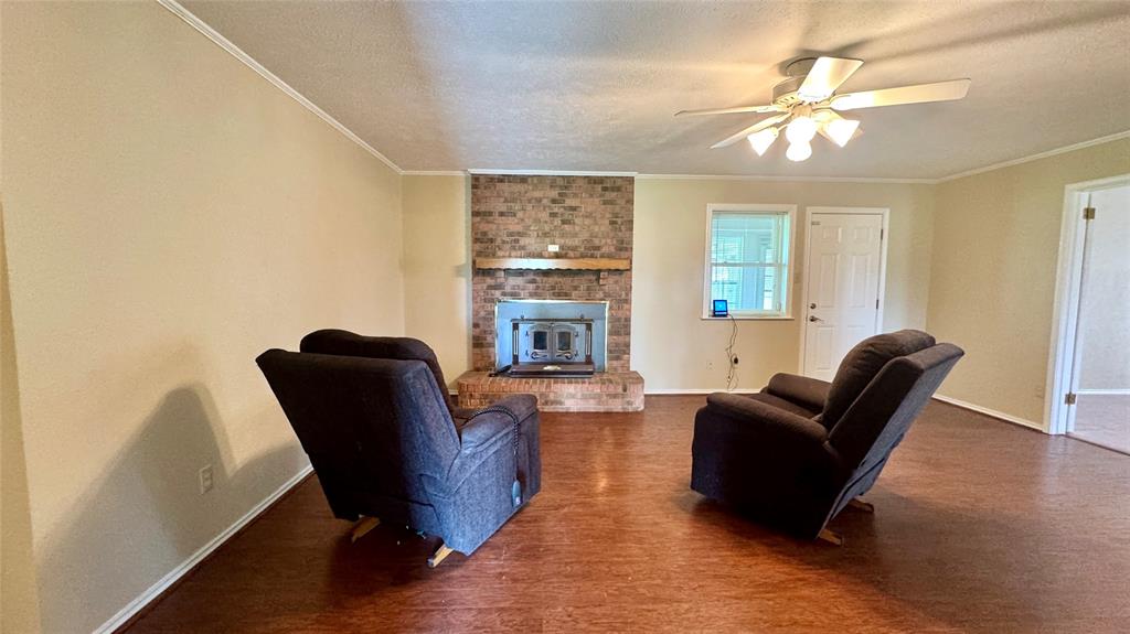 2050 Griffith Avenue Terrell, TX 75160 - Photo 4 of 27 a living room with furniture and a fireplace