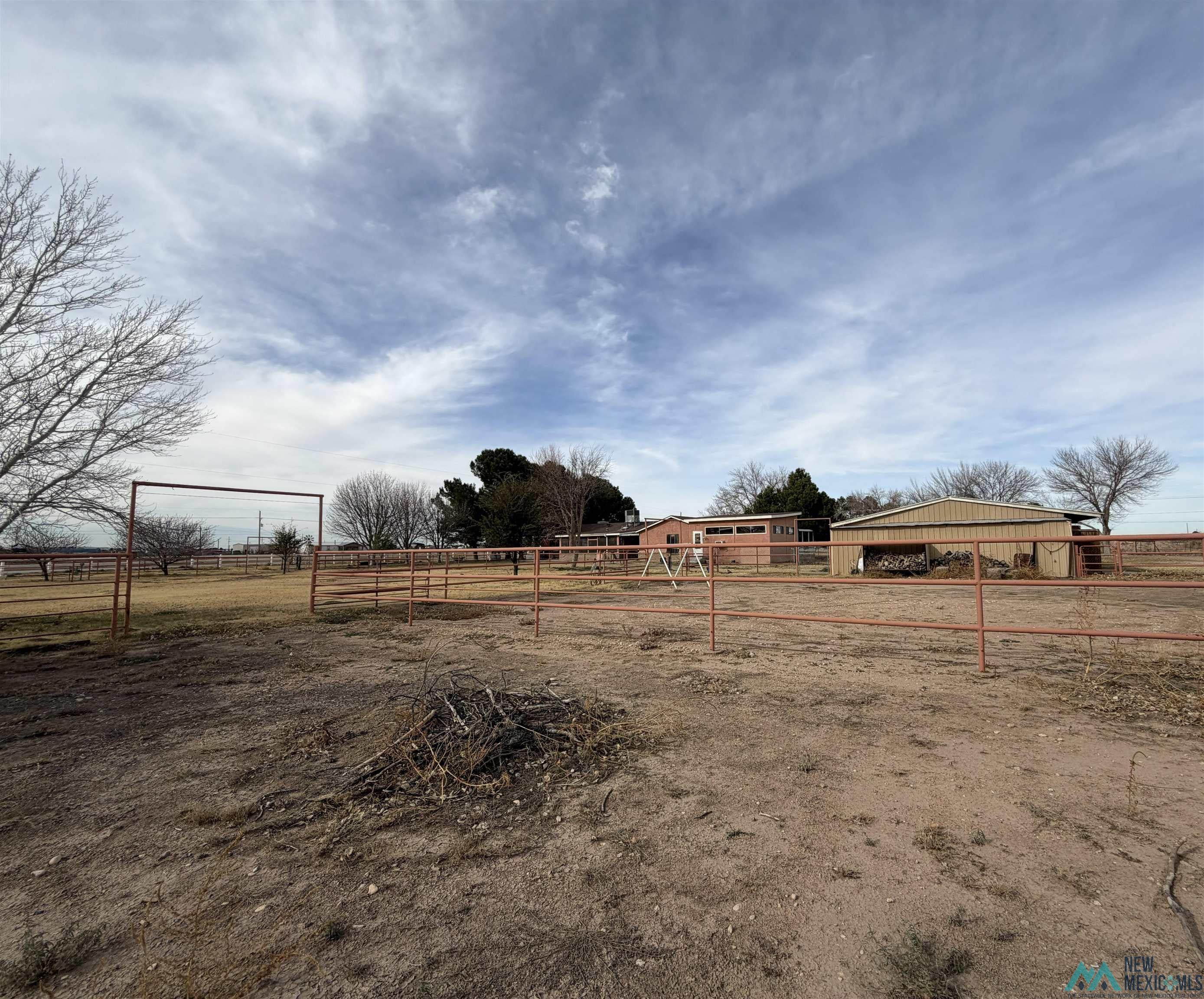 2001 East Derrick Road Carlsbad, NM 88220 - Photo 16 of 84 View of yard featuring a view of rural / pastoral area and an outbuilding