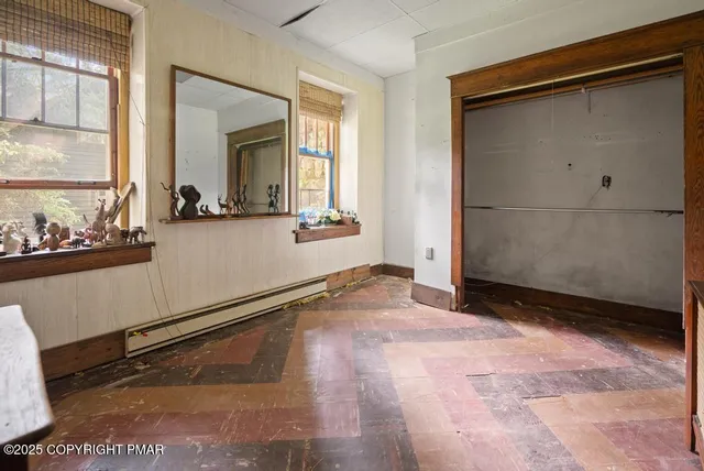 a view of a room with stairs and white walls