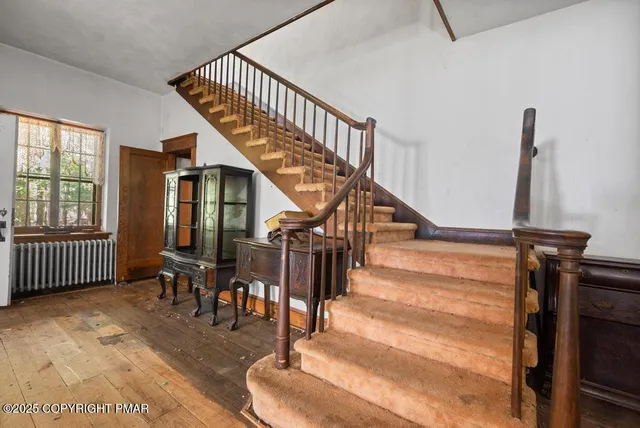 a view of a porch with table and chairs