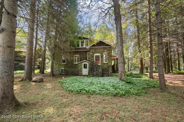 a view of a house with a tree s