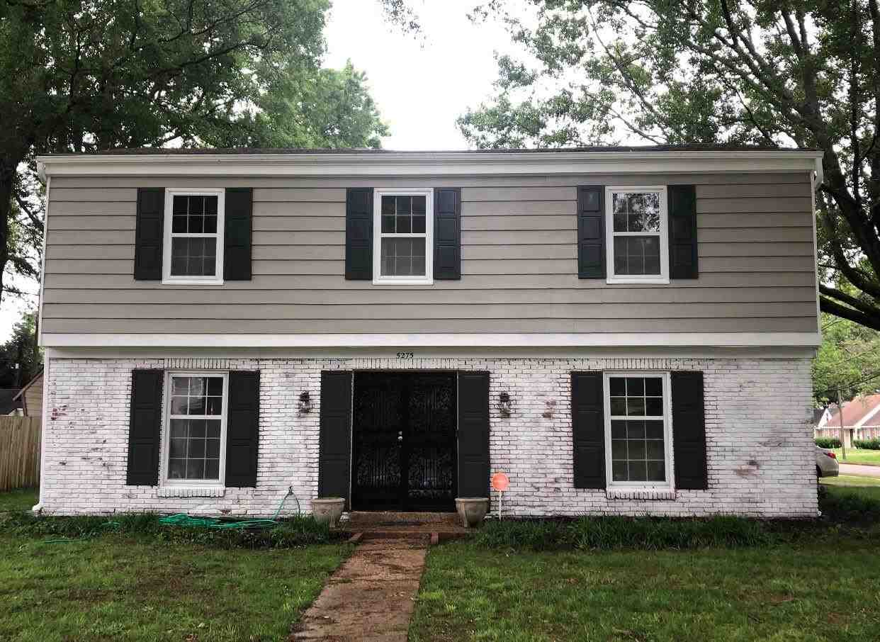 front view of a house with a yard