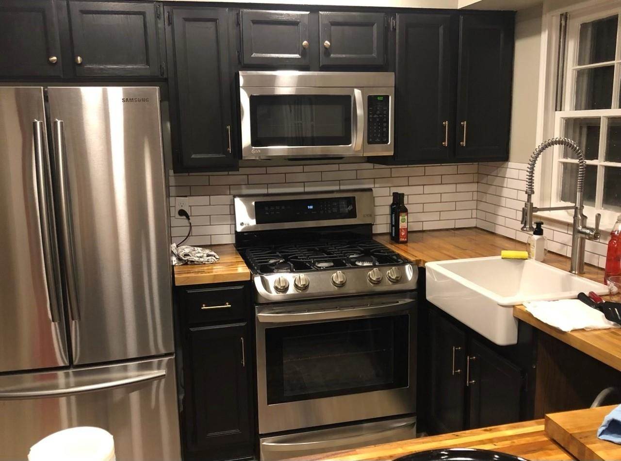 5275 Dee Road Memphis, TN 38117 - Photo 2 of 3 a kitchen with a sink stove and refrigerator