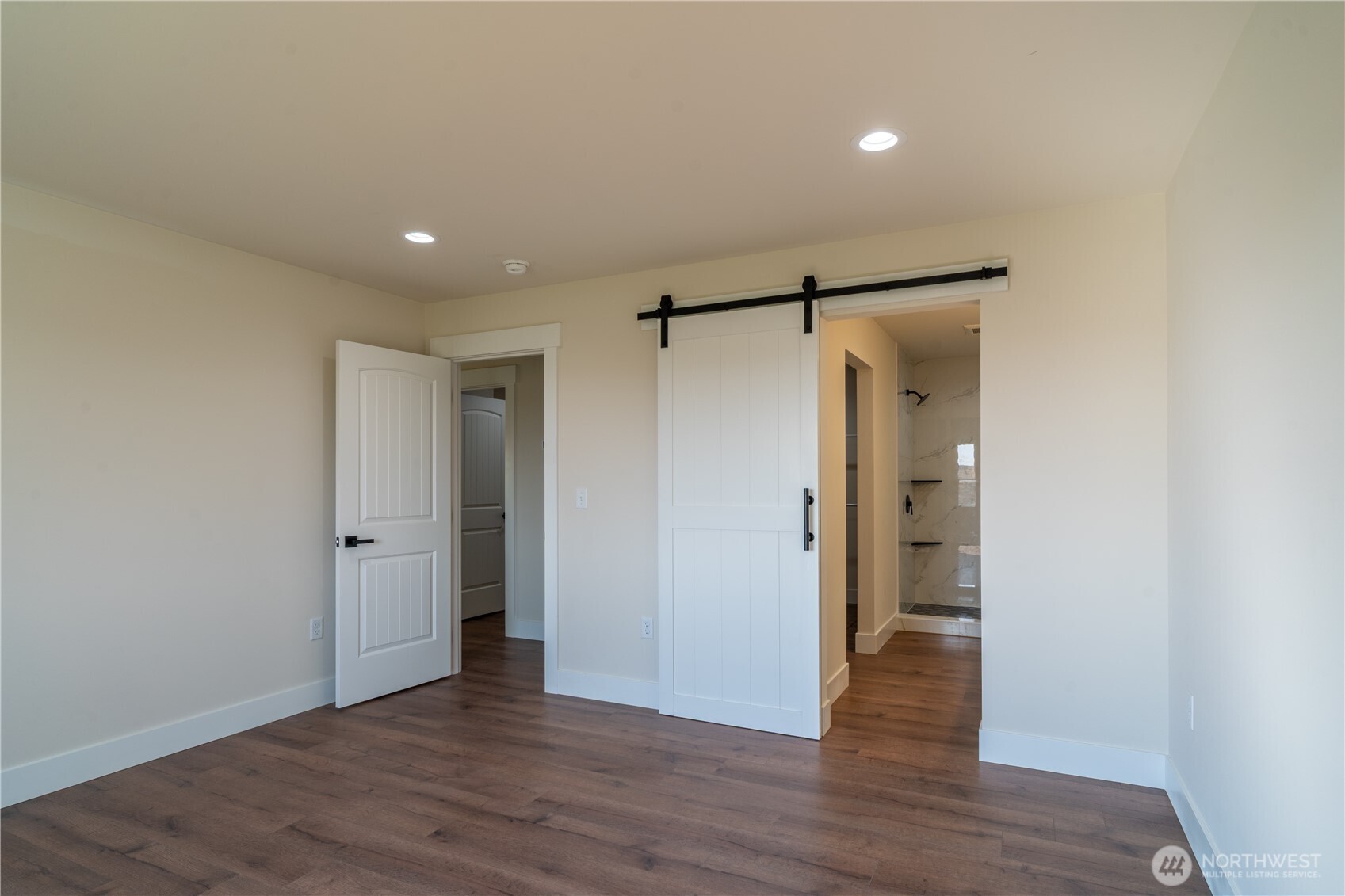 70 Sunwest Drive Ephrata, WA 98823 - Photo 16 of 34 a view of an empty room with wooden floor and a bathroom