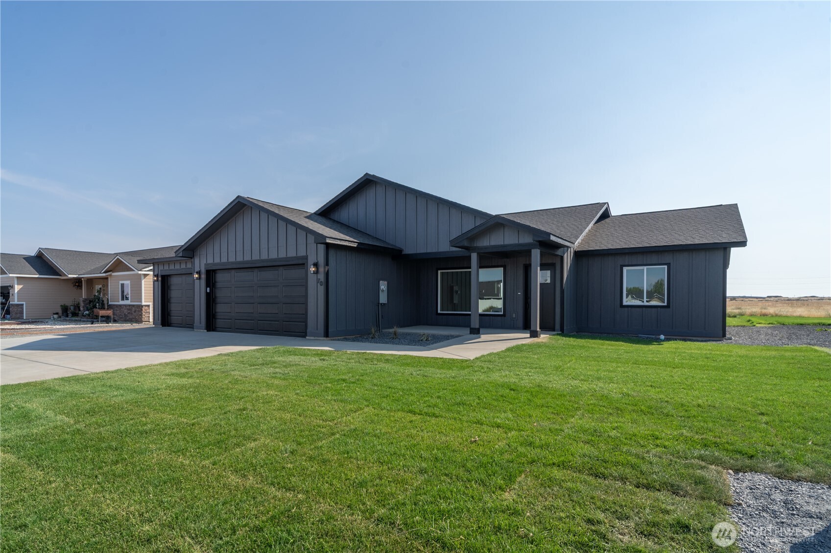 70 Sunwest Drive Ephrata, WA 98823 - Photo 2 of 34 a view of a house with a yard and garage