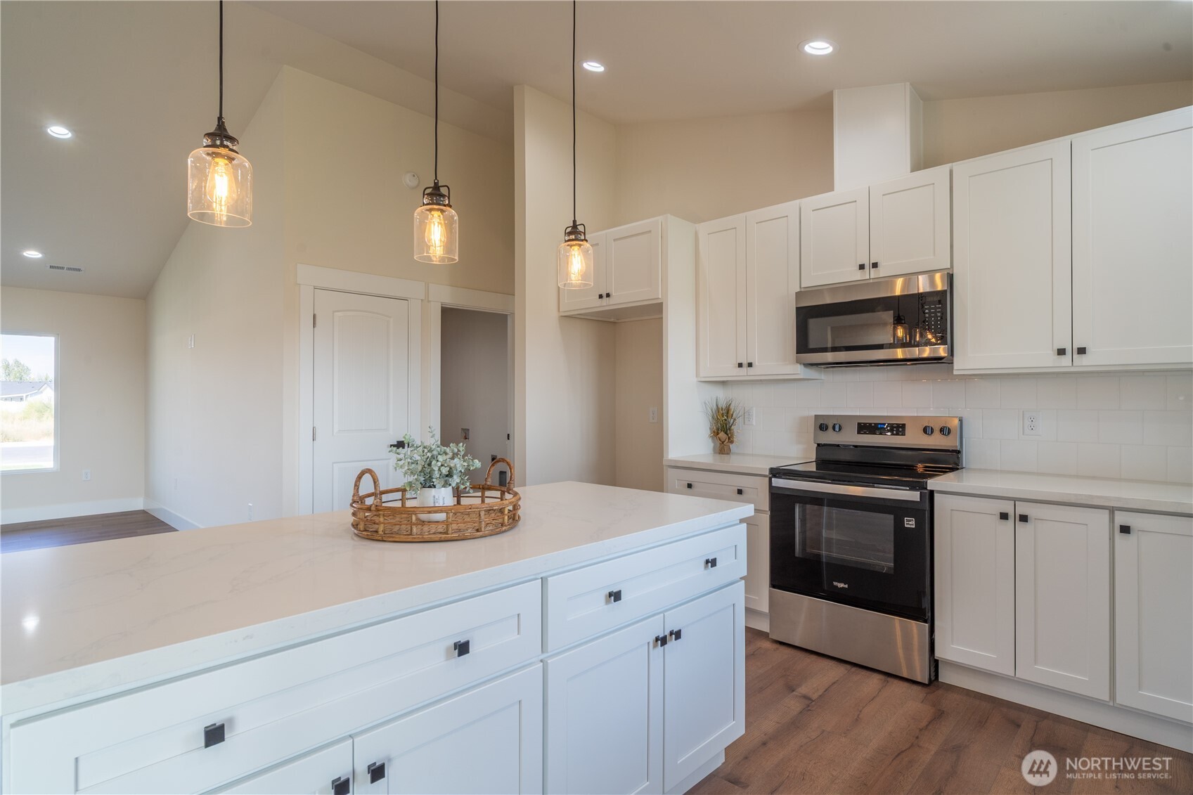 70 Sunwest Drive Ephrata, WA 98823 - Photo 5 of 34 a kitchen with kitchen island white cabinets and white appliances