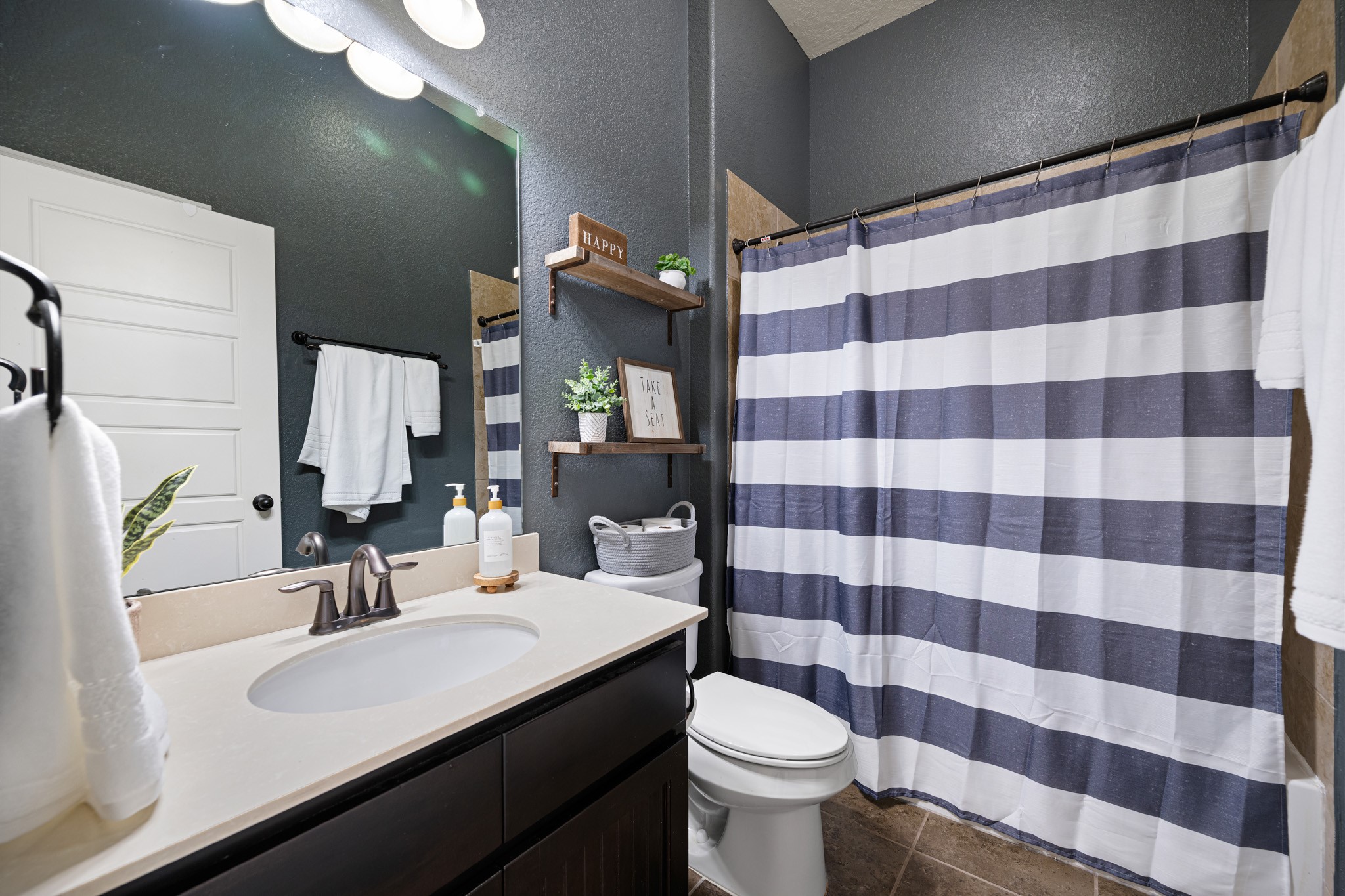 8131 Brinkmeyer Road Needville, TX 77461 - Photo 28 of 34 Secondary bathroom is filled with charm and includes a tub/shower combo.