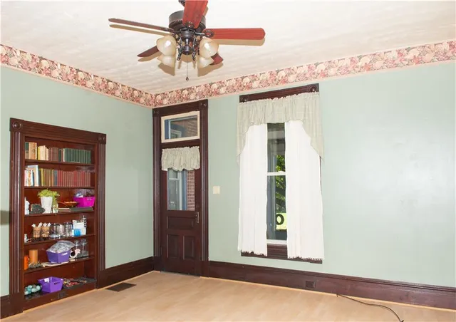 a view of a hallway with a large window