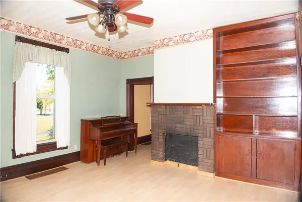 a view of livingroom with furniture and chandelier fan