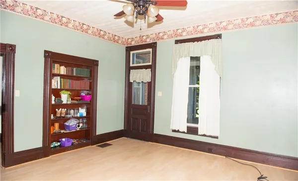 a view of a hallway with windows