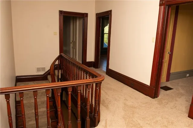 a view of staircase with rug