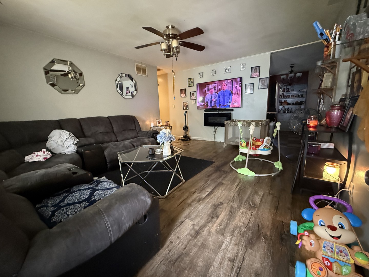 1021 Briarcliff Drive Rantoul, IL 61866 - Photo 2 of 33 a living room with furniture and a flat screen tv