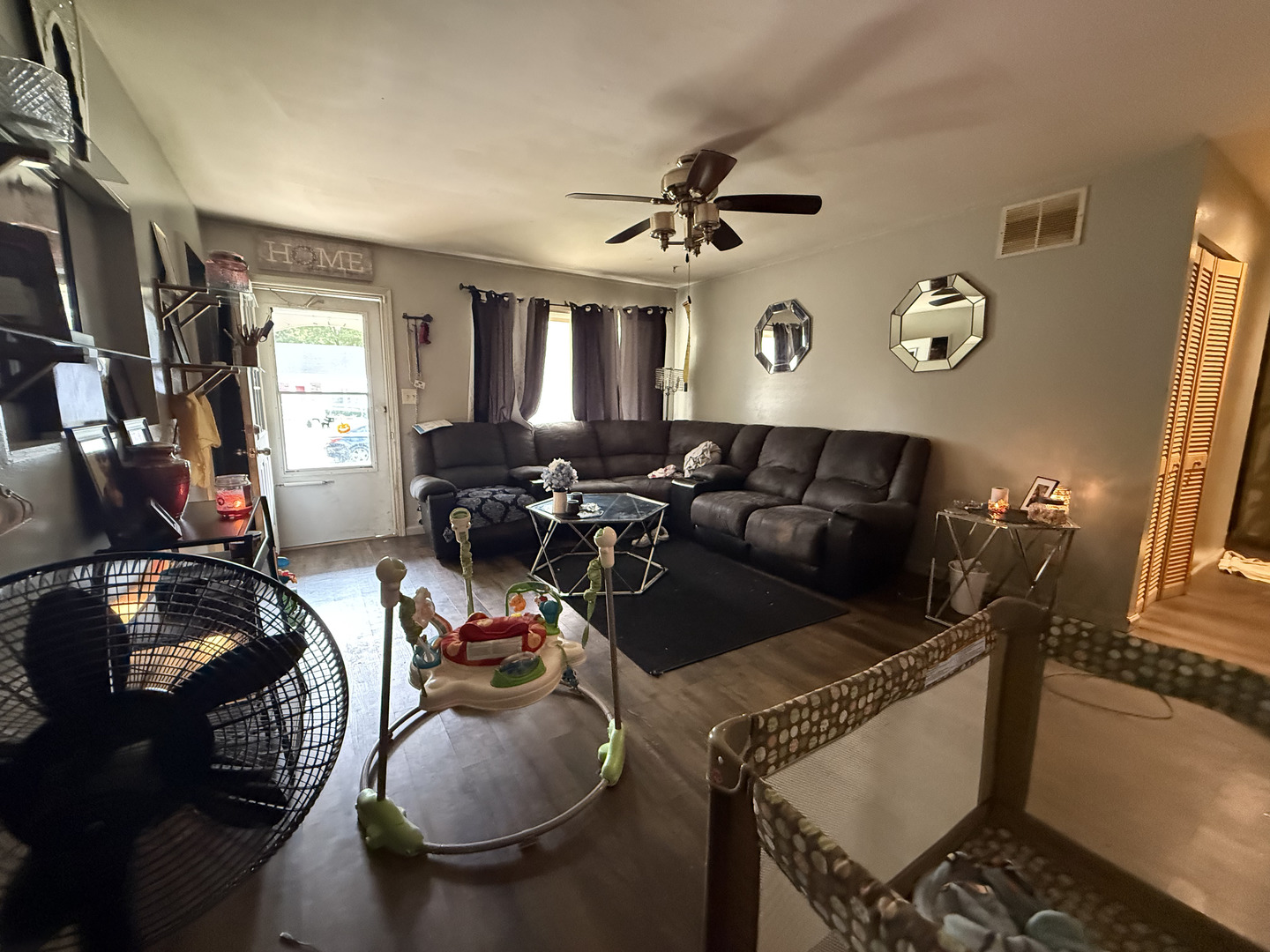 1021 Briarcliff Drive Rantoul, IL 61866 - Photo 3 of 33 a living room with furniture a window and gym equipment