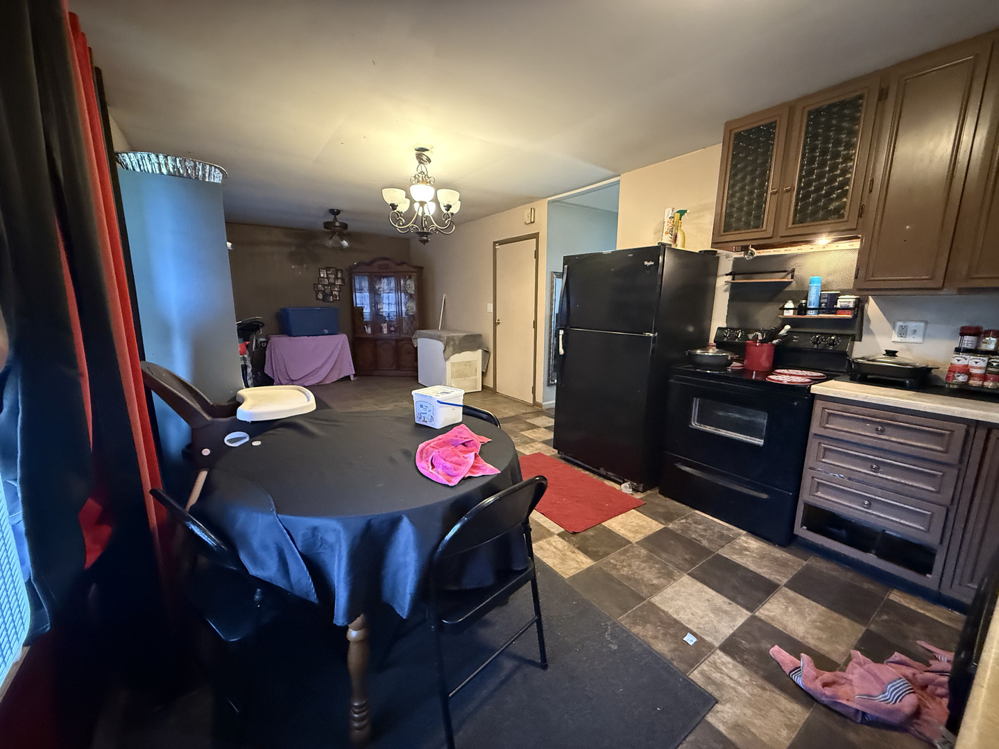 1021 Briarcliff Drive Rantoul, IL 61866 - Photo 9 of 33 a kitchen with stainless steel appliances granite countertop a dining table chairs refrigerator and a stove