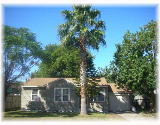 4409 Spring Street Corpus Christi, TX 78415 - Photo 1 of 1 a front view of a house with yard