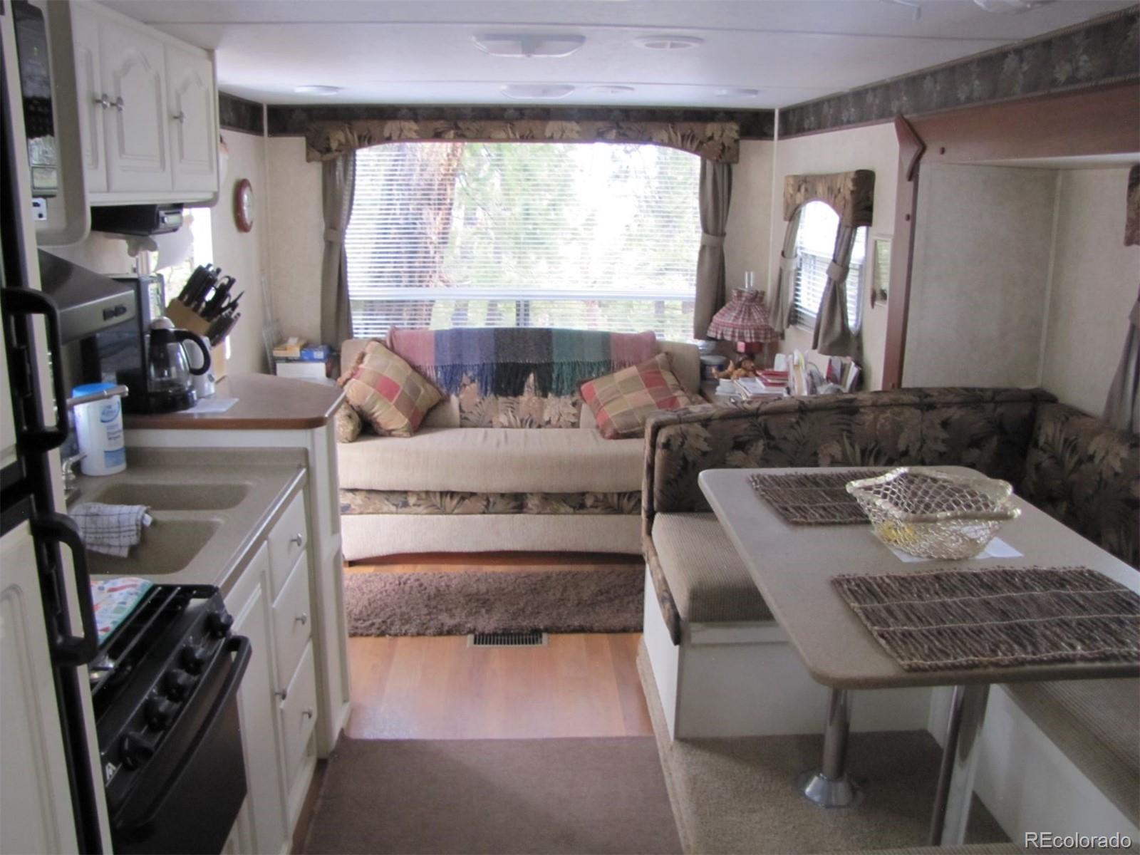 94 Pullman Loop Fairplay, CO 80440 - Photo 12 of 21 a living room with stainless steel appliances granite countertop furniture and a large window