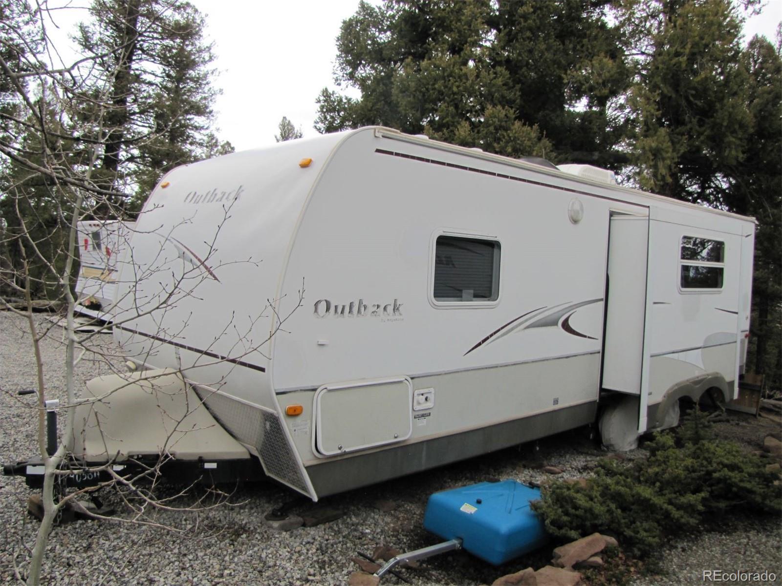 94 Pullman Loop Fairplay, CO 80440 - Photo 7 of 21 a view of a white house with a yard