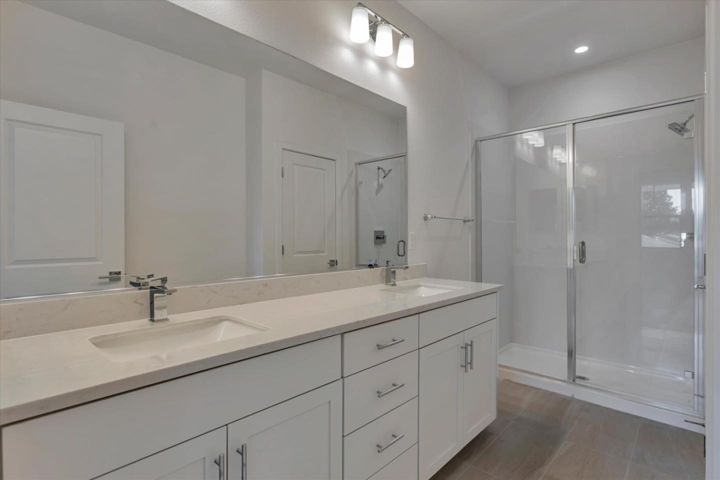 2741 Oak Road Walnut Creek, CA 94597 - Photo 13 of 20 a bathroom with a shower sink double and mirror