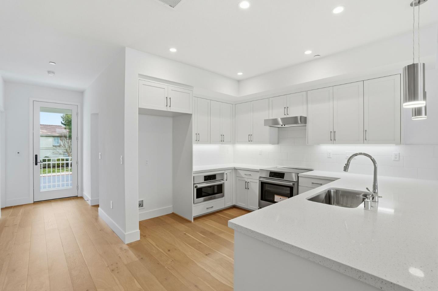 2741 Oak Road Walnut Creek, CA 94597 - Photo 17 of 20 a kitchen with sink cabinets and wooden floor