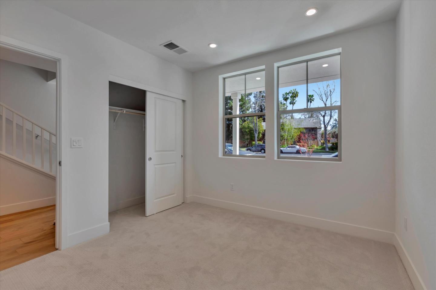 2741 Oak Road Walnut Creek, CA 94597 - Photo 3 of 20 an empty room with windows and outdoor view