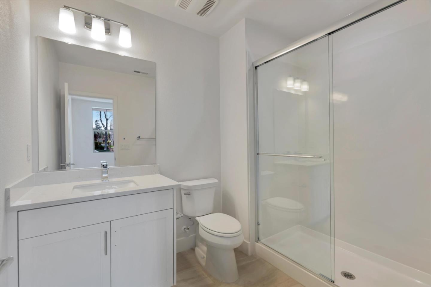 2741 Oak Road Walnut Creek, CA 94597 - Photo 5 of 20 a bathroom with a sink a toilet and shower