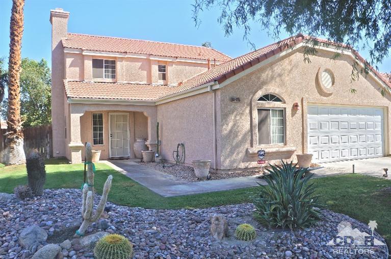 80928 Rio Grande Avenue Indio, CA 92201 - Photo 1 of 25 a front view of a house with garden