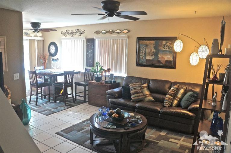80928 Rio Grande Avenue Indio, CA 92201 - Photo 2 of 25 a living room with furniture and a large window